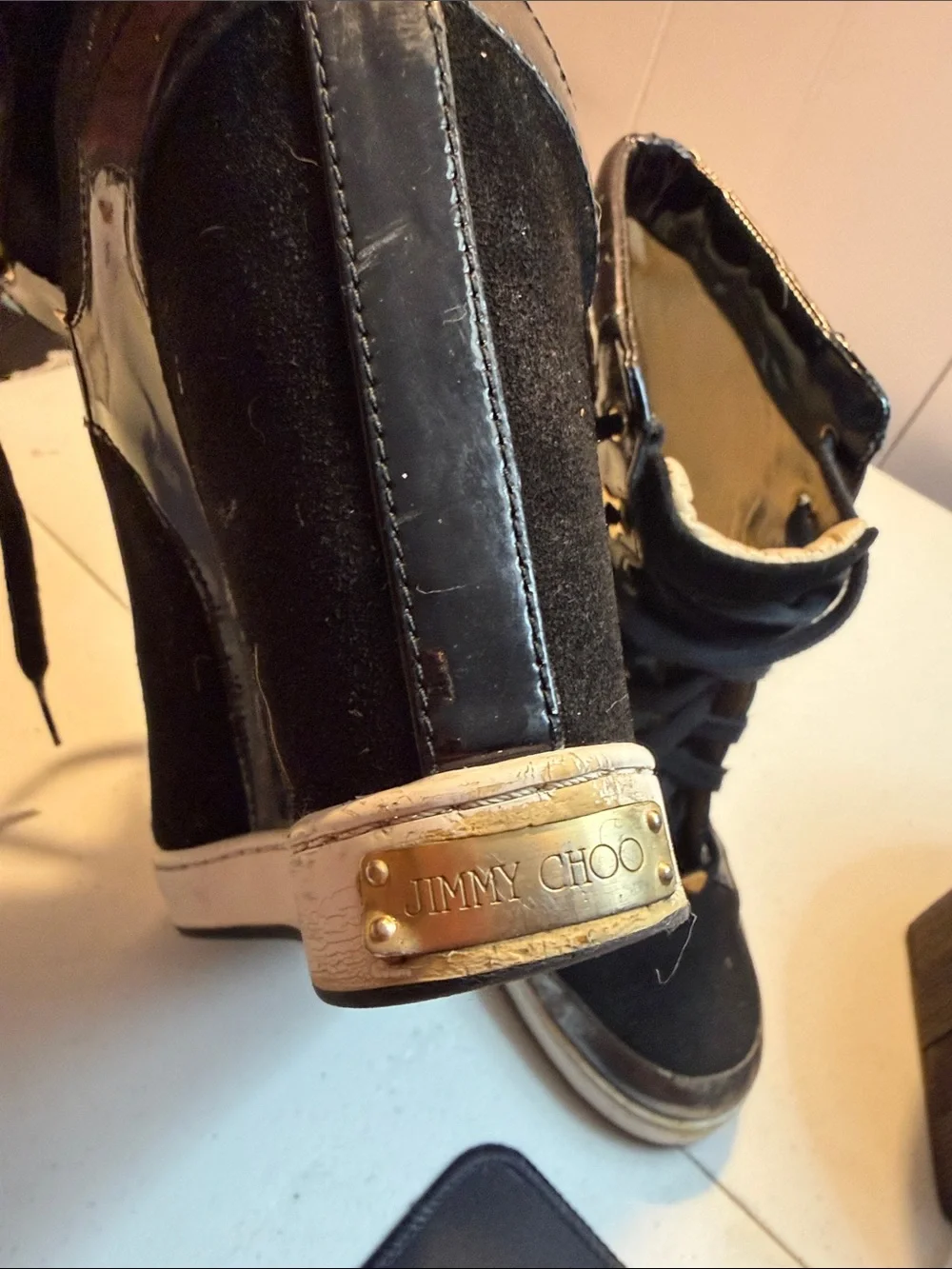 Jimmy Choo Black Wedge High-Top Sneakers with Gold Accents